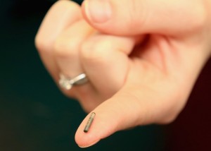 WOLVERHAMPTON, ENGLAND - APRIL 04: A veterinary nurse holds a dog micro-chip at the PDSA hospital on April 4, 2016 in Wolverhampton, England. From 6th April 2016 it will become law, in the UK, that all dogs should be microchipped and recorded in the National Canine Database. Many owners are unaware of the new legislation and it is estimated that more than 1 million dogs have still not been micro-chipped leaving owners facing fines. (Photo by Christopher Furlong/Getty Images)